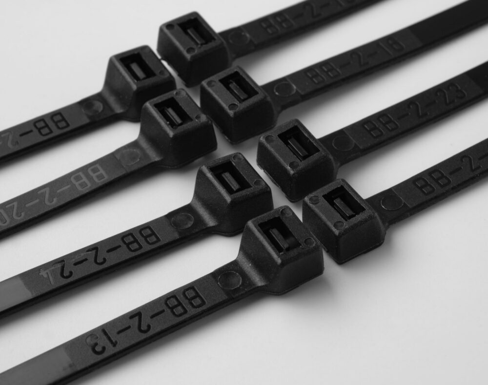 black nylon cable ties arranged in stack on white background